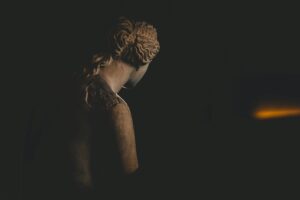 Dramatically lit sculpture in Paris adds a mysterious nighttime ambiance.