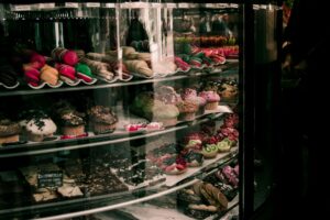 A colorful assortment of pastries, macarons, and cupcakes displayed in a Brussels bakery.
